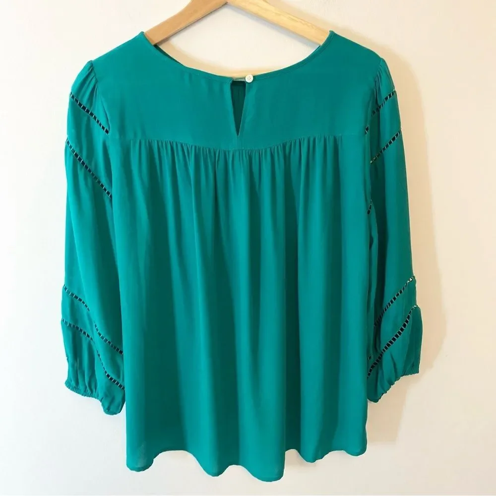 Ann Taylor Loft green jewel toned blouse with cut out detail size S.